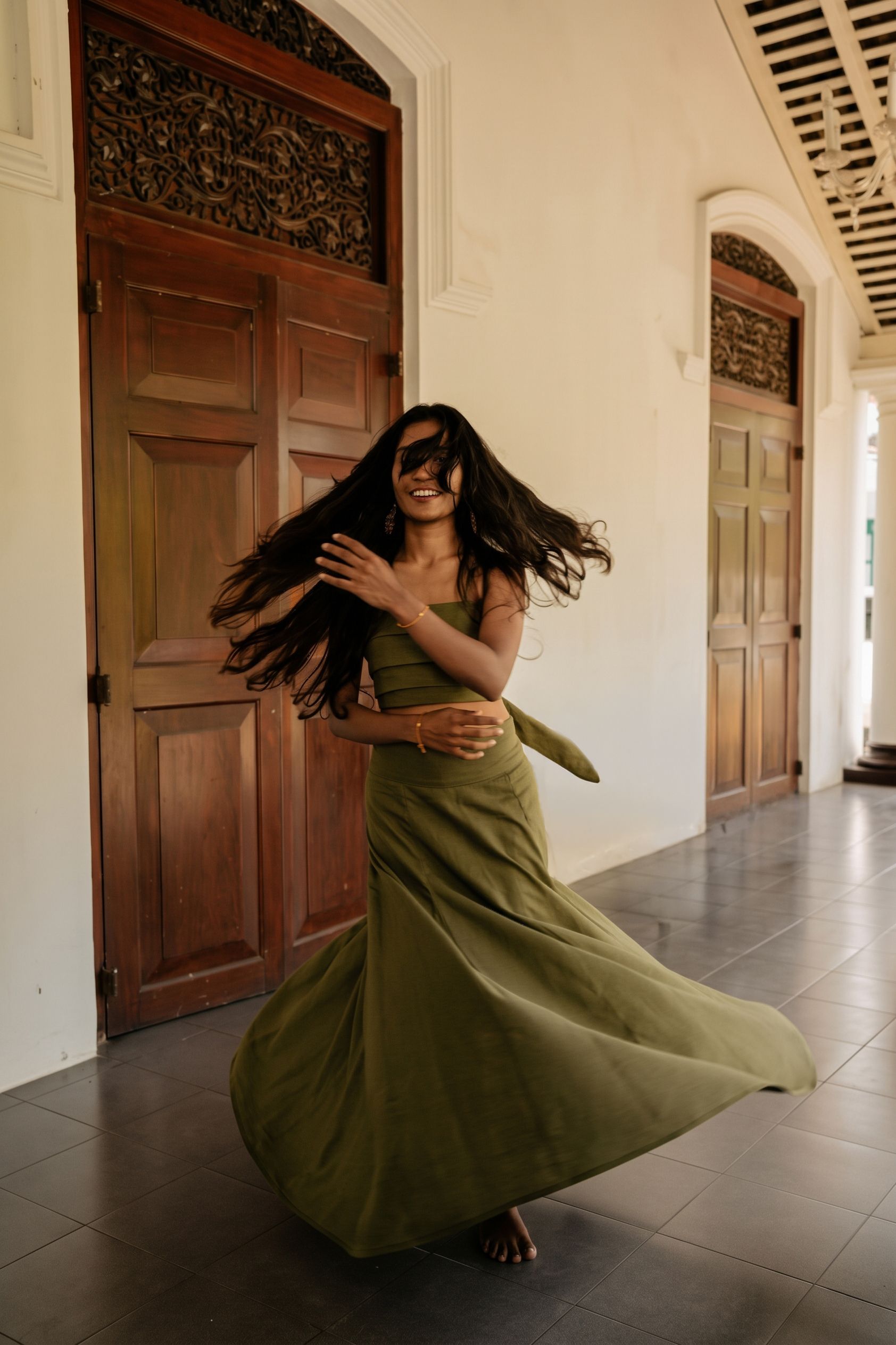 Olive linen in motion in the Walawwa hallway